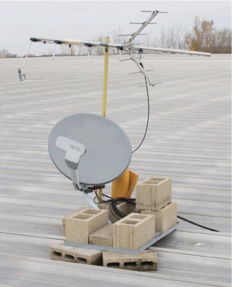 Using ballast to mount a satellite dish on metal roof encourages corrosion