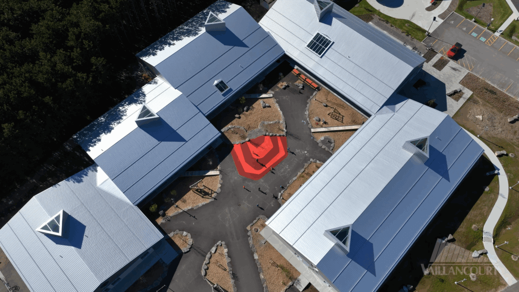 Ecole du Zenith aerial view showing five metal roof tops with S-5! ColorGard and S-5-N clamps.